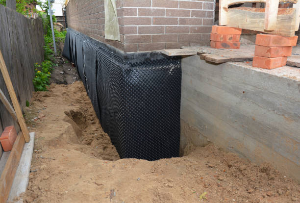 SJ Waterproofing Pros technician performing targeted Exterior Waterproofing assessment in Seminole, AL